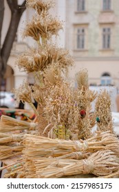 Symbolic Sheaves Of Wheat With Flower Decorations - Didukh As A Ukrainian Christmas Symbol On Souvenir Market - Sheaf Of Wheat Used For Celebrating Christmas In Ukraine, Ancient Pagan Traditions