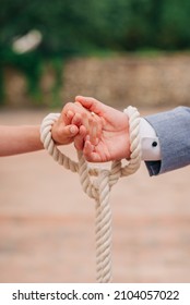 Symbolic Wedding Ceremony, Two Hands Tied With Ropes.