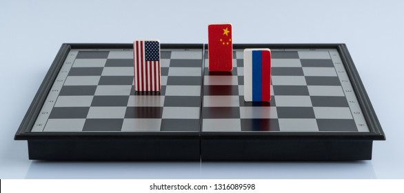 Symbols Flag Of Russia, USA And China On The Chessboard. The Concept Of Political Game.