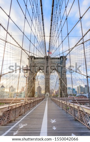Symetric Brooklyn Bridge with views of Manhattan during Sunrise