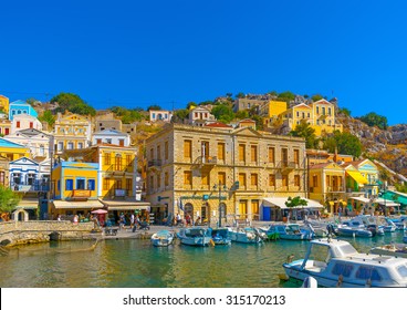 SYMI, GREECE - AUGUST 25, 2014: The pictorial harbor of Symi on August 25, 2014 on Symi island, in Greece.