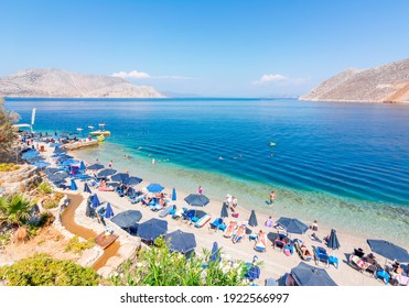 Symi, Greece - September 2019: Nos Beach On Symi Island