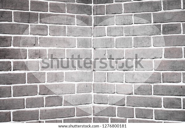 Symmetric drawn heart on angle of brick wall\
close-up in grayscale. Monochrome background with painted heart.\
Interior with love symbol decor. Valentine day image on wall.\
Brickwork. Exterior\
picture.