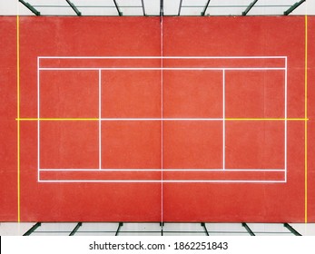 symmetrical aerial view of a paddle tennis court