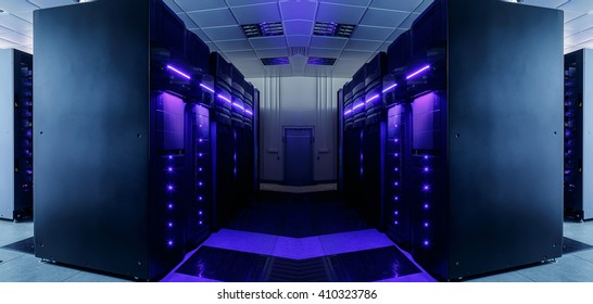 symmetrical data center room with futuristic beams and rows of equipment