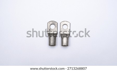 Symmetrical Electrical Hardware, Large Silver Lugs flat lay on a White Surface