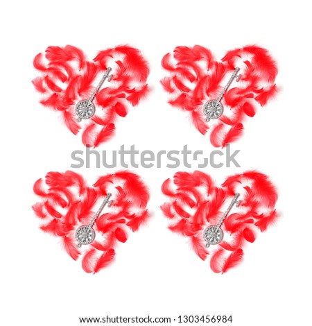symmetrical pattern of four red hearts laid out with feathers and keys on a white background. flat lay, top view, square