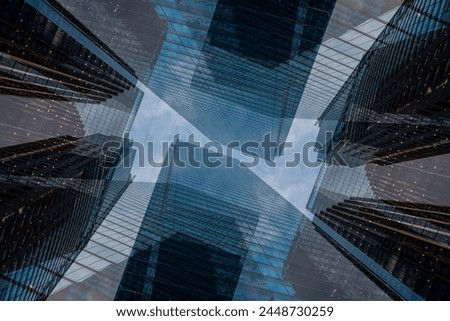 symmetry and mirrored geometry pattern, reflected skyscrapers and modern buildings abstract background, lines and tunnel futuristic technology concept