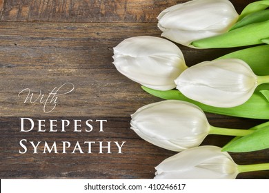 Sympathy Text Card With White Tulip Flowers.
Rustic Wooden Background.