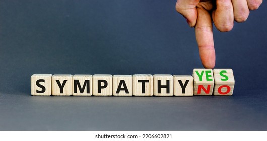 Sympathy Yes Or No Symbol. Concept Words Sympathy Yes Or Sympathy No On Wooden Cubes. Psychologist Hand. Beautiful Grey Table Grey Background. Business Sympathy Yes Or No Concept. Copy Space.