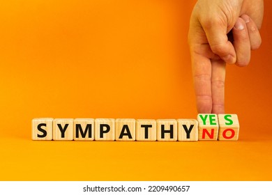 Sympathy Yes Or No Symbol. Concept Words Sympathy Yes Or Sympathy No On Wooden Cubes. Psychologist Hand. Beautiful Orange Table Orange Background. Business Sympathy Yes Or No Concept. Copy Space.