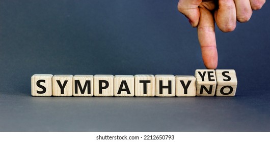 Sympathy Yes Or No Symbol. Concept Words Sympathy Yes Or Sympathy No On Wooden Cubes. Psychologist Hand. Beautiful Grey Table Grey Background. Business Sympathy Yes Or No Concept. Copy Space.