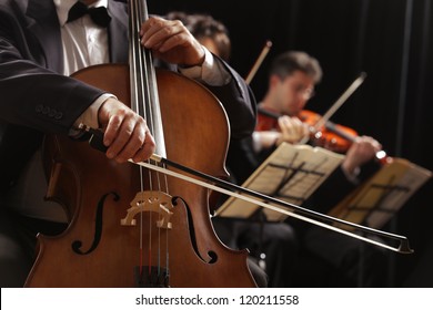 Symphony Concert, A Man Playing The Cello, Hand Close Up