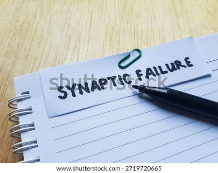 Synaptic failure writting on table background. 