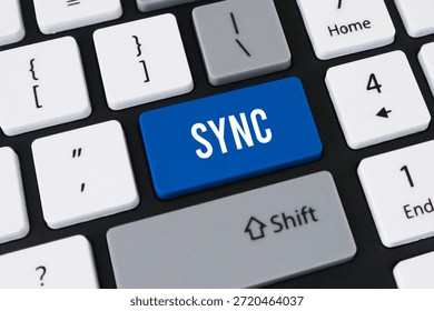 Sync button on computer keyboard. Concept of data synchronization, cloud computing and device connectivity.