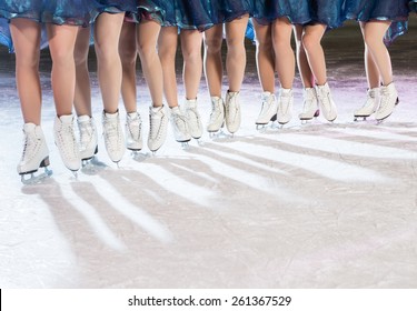 Synchronized Skating Team. Detail On Legs And Ice Skates.