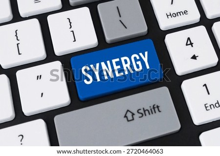 Synergy button on computer keyboard. Concept of business collaboration, team partnership and digital teamwork.