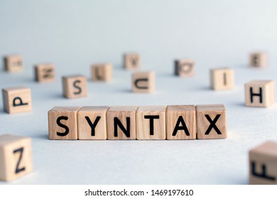 syntax - word from wooden blocks with letters, grammatical arrangement concept, random letters around, top view on wooden background