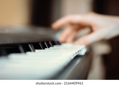 Synthesizer Keys With Selective Focus And Hand In The Background, Synth Playing