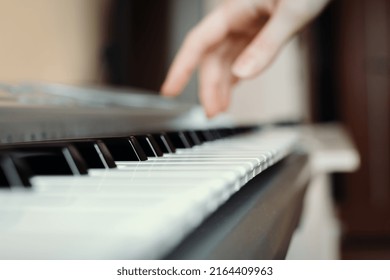 Synthesizer Keys With Selective Focus And Hand In The Background, Synth Playing