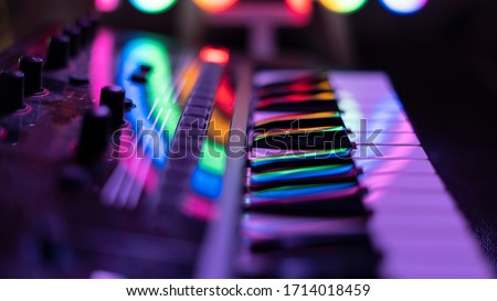 Synthesizer in the light of night lights