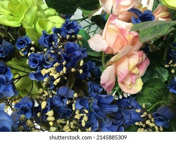 Synthetic flowers in various colors. Often used as a decoration that is not easily damaged and durable. - Shutterstock ID 2145885309