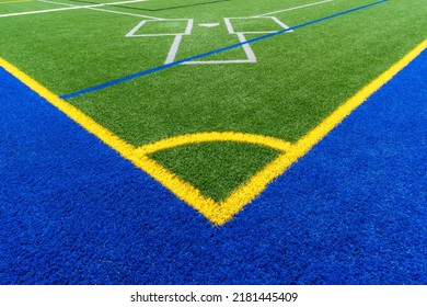 Synthetic Turf Multi Sport Field With Soccer, Football, Lacrosse And Baseball Batters Box Lines In White, Gray, , Blue, And Yellow. 