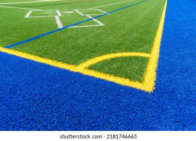 Synthetic Turf Multi Sport Field With Soccer, Football, Lacrosse And Baseball Batters Box Lines In White, Gray, , Blue, And Yellow. 