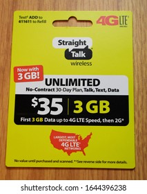 Syracuse, New York, USA - February 13, 2020: Prepaid No-contract Mobile Phone Service Plan Card From Straight Talk Wireless Sold By Walmart With Unlimited Talk, Text, And Data