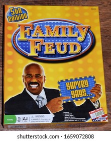 Syracuse, New York, USA - February 28, 2020: Yellow Family Feud 5th Edition Board Game With Steve Harvey On The Box