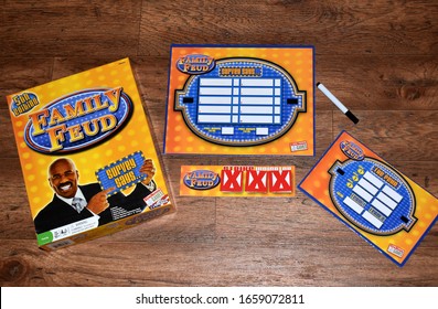 Syracuse, New York, USA - February 28, 2020: Yellow Family Feud 5th Edition Board Game With Steve Harvey On The Box