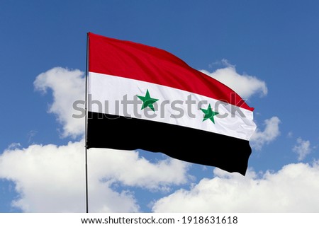 Syria flag isolated on the blue sky with clipping path. close up waving flag of Syria. flag symbols of Syria.