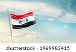 Syria national flag waving in beautiful sky.