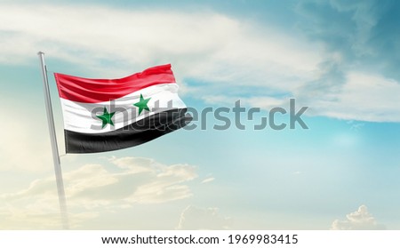 Syria national flag waving in beautiful sky.