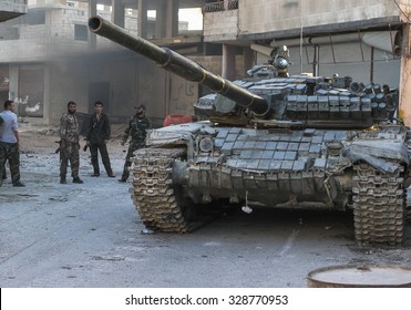 SYRIA, SHABAA, SEPTEMBER 2013. Syrian Soldiers Of The National Army Are Near The Tank After A Battle With Rebels In The Suburbs Of Damascus, Shabaa.