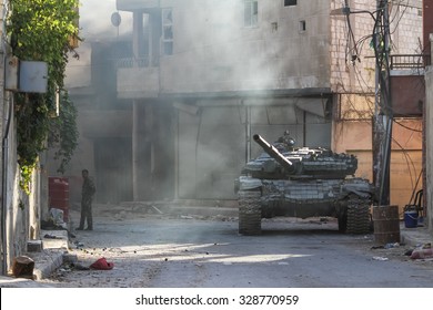 SYRIA, SHABAA, SEPTEMBER 2013. Tank Syrian National Army Stands Between The Buildings In The Suburbs Of Damascus, After The Battles With Rebels.