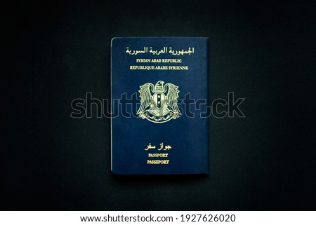 Syrian Passport travel document on a black background issued in Syria