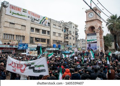 Syrians praise the death of Iran top commander Qasem Soleimani during their weekly protest against the Syrian regime in rebel-held Idlib, in northwestern Syria. on January 3, 2020
