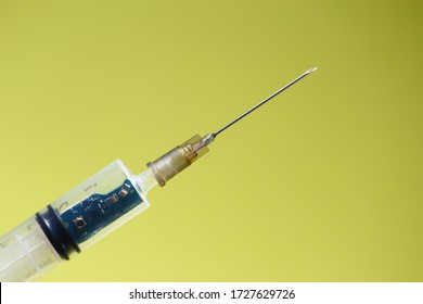 Syringe With A Chip. The Concept Of The Theory Of Conspiracy And Implantation Of Vaccinated Chips. Global Control Of Humanity.