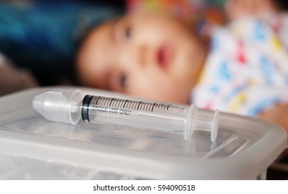 Syringe for cleaning  nose have background is baby infant
