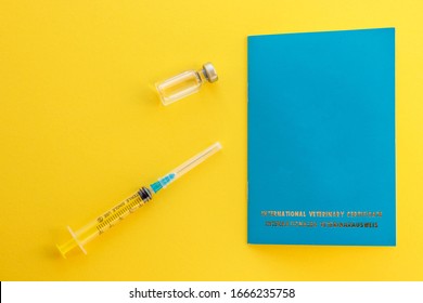 Syringe, Glass Vial With Liquid And Animal Passport For Indicating Vaccinations And Microchip Number. International Veterinary Certificate.  Cat Or Dog Document ID. Health Care And Medicine.