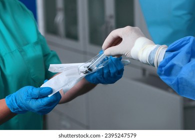 Syringe is in hands of doctors. Modern surgery. Work of doctors in operating room. close-up. - Powered by Shutterstock