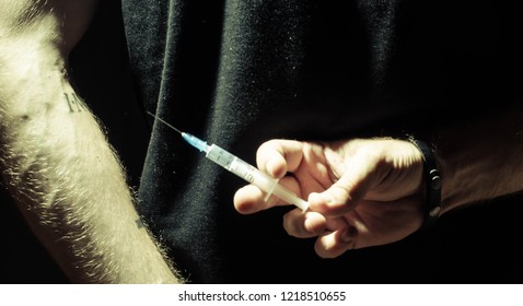 syringe, human vein - Shutterstock ID 1218510655