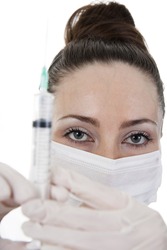 A Doctor In Medical Gloves Enters The Medicine With A Syringe To The Patient Intramuscular