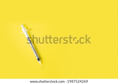 Similar – Medical syringe on colorful background.