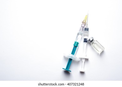 Syringe, medical injection. Medicine isolated plastic vaccination equipment with needle on white background. Liquid drug or narcotic. Health care in hospital.