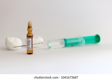Syringe with needle and vaccine drug for flu shot - Shutterstock ID 1041673687