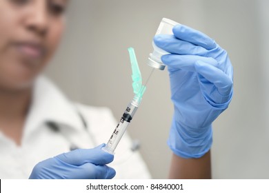 Syringe preparation by a female doctor