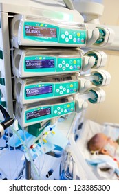 Syringe Pumps In Pediatric Intensive Care Unit With Child On Background