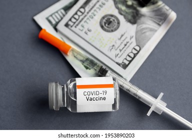 Syringe And Vaccine Ampoule, American Dollar Money Banknotes,  Coronavirus Pandemic, Vaccine Availability In Rich And Poor Countries. Sale Of Medicines.